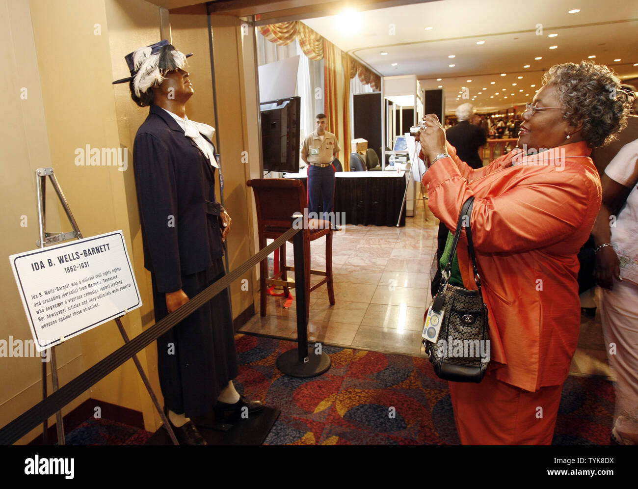 Attendees take pictures of a wax statue of Ida B. Wells-Barnett at the NAACP Centennial Convention in New York City on July 13, 2009.    (UPI Photo/John Angelillo)   . Stock Photo