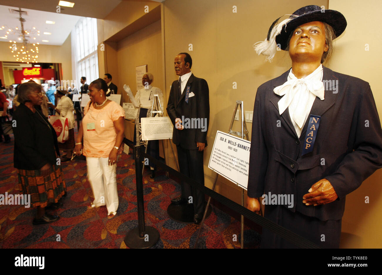 Attendees stand next to a wax statue of Ida B. Wells-Barnett at the NAACP Centennial Convention in New York City on July 13, 2009.    (UPI Photo/John Angelillo)   . Stock Photo