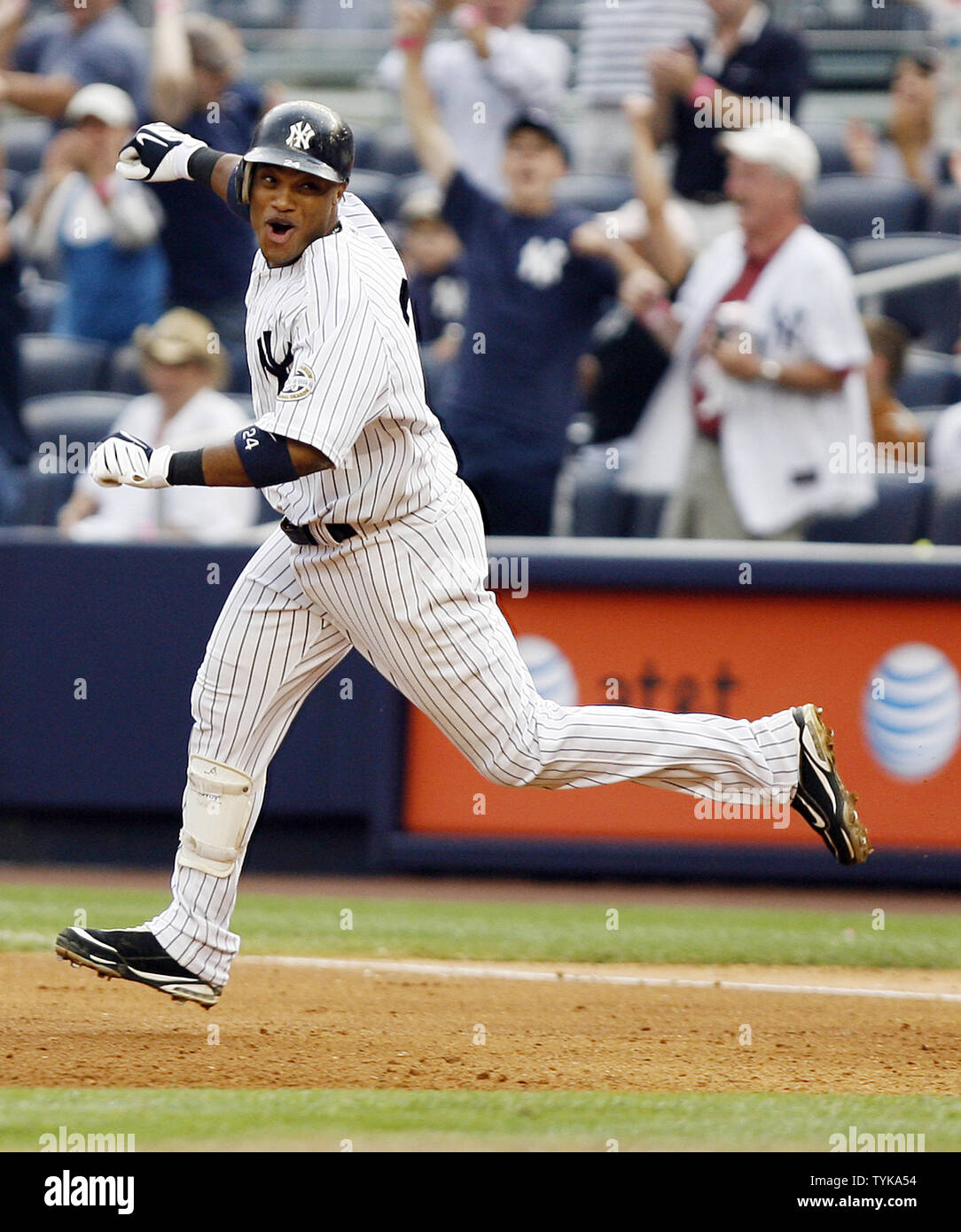 New York Yankees Robinson Cano reacts after hitting a game winning walk off  RBI single in the eleventh inning at Yankee Stadium in New York City on  August 12, 2009. The Yankees
