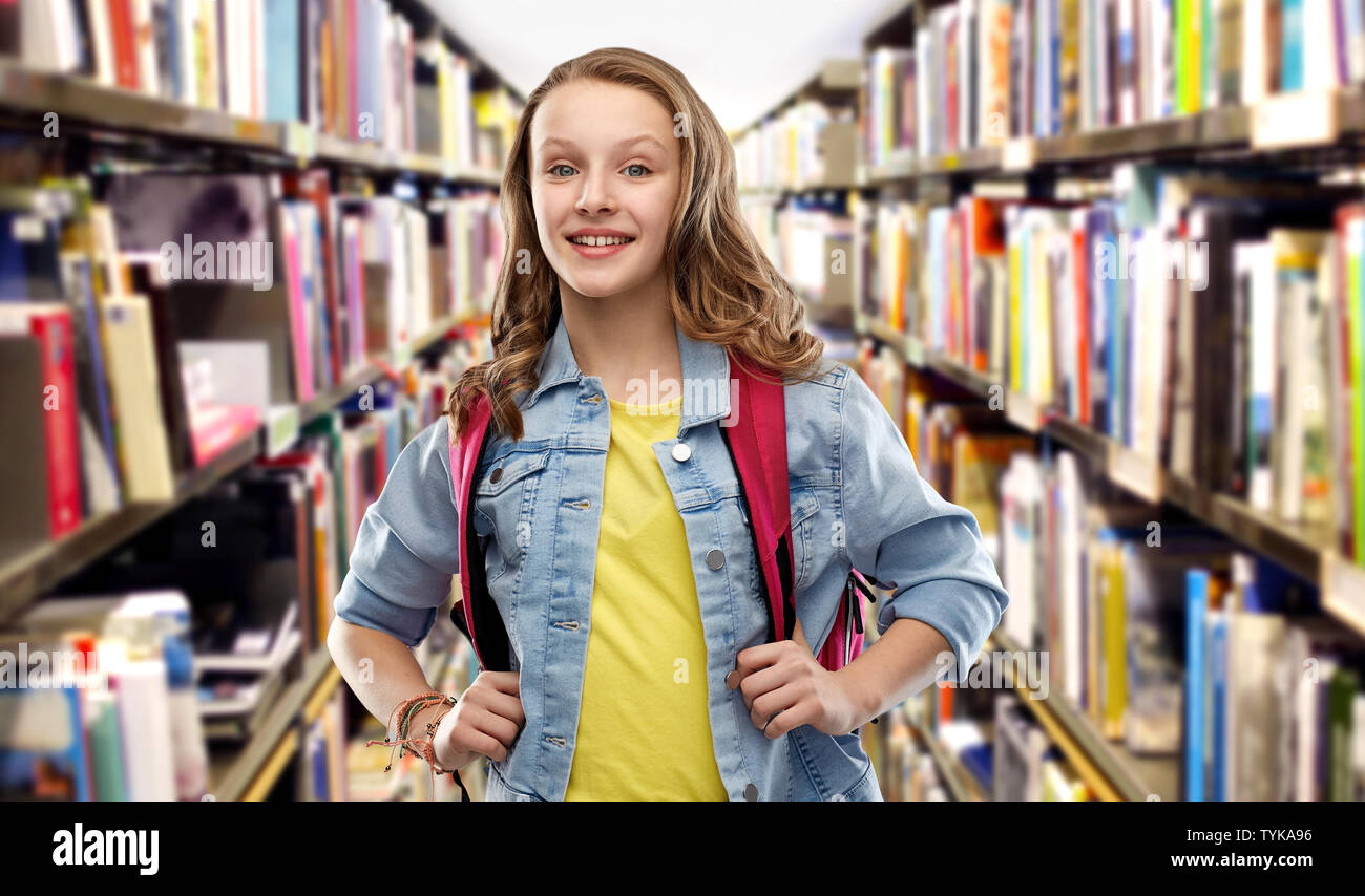 smiling student girl with school bag at library Stock Photo - Alamy