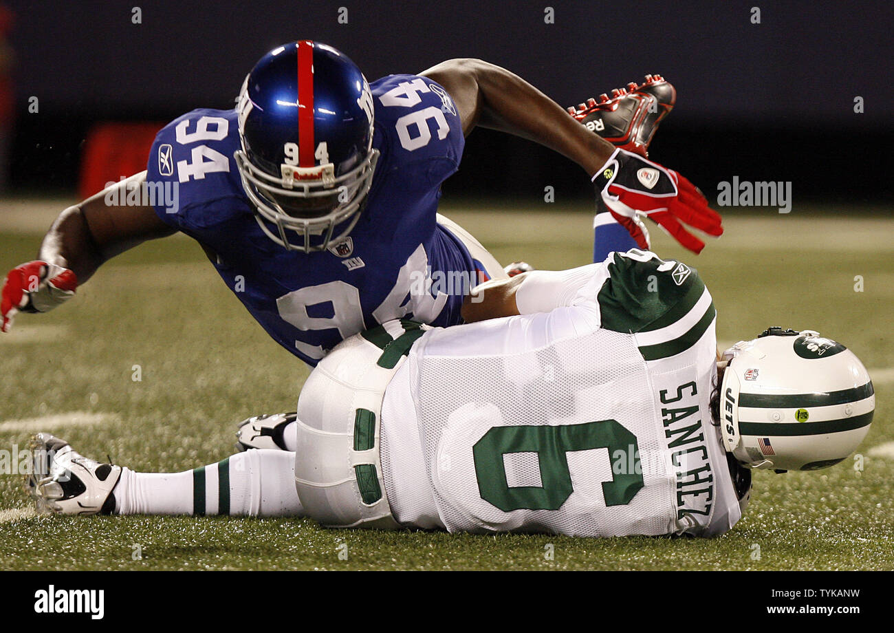 New York Jets Mark Sanchez gets sacked for 9 yards by New York Giants  Mathias Kiwanuka in the first quarter of a preseason game at Giants Stadium  in East Rutherford, New Jersey