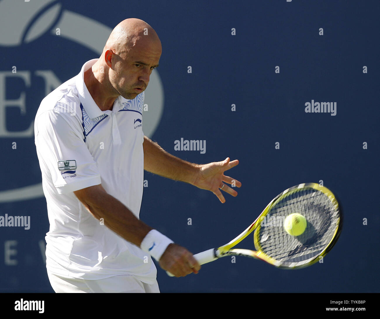 Ivan Ljubicic (CRO) hits a backhand to Novak Djokovic (SRB) in their first  round match at the US Open Tennis Championships at the Billie Jean King  National Tennis Center in New York