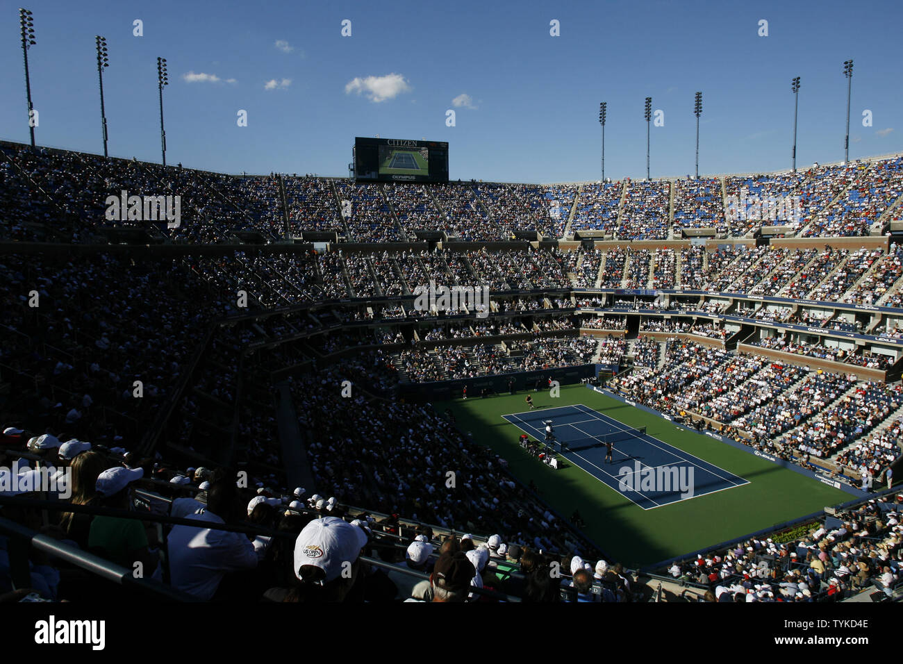 The sun casts shadow on the spectators as Roger Federer of Switzerland plays Juan Martin Del Potro of Argentina in the first set of their mens final match in Arthur Ashe Stadium at the US Open Tennis Championships at the Billie Jean King National Tennis Center in New York on September 14, 2009.     UPI/John Angelillo Stock Photo