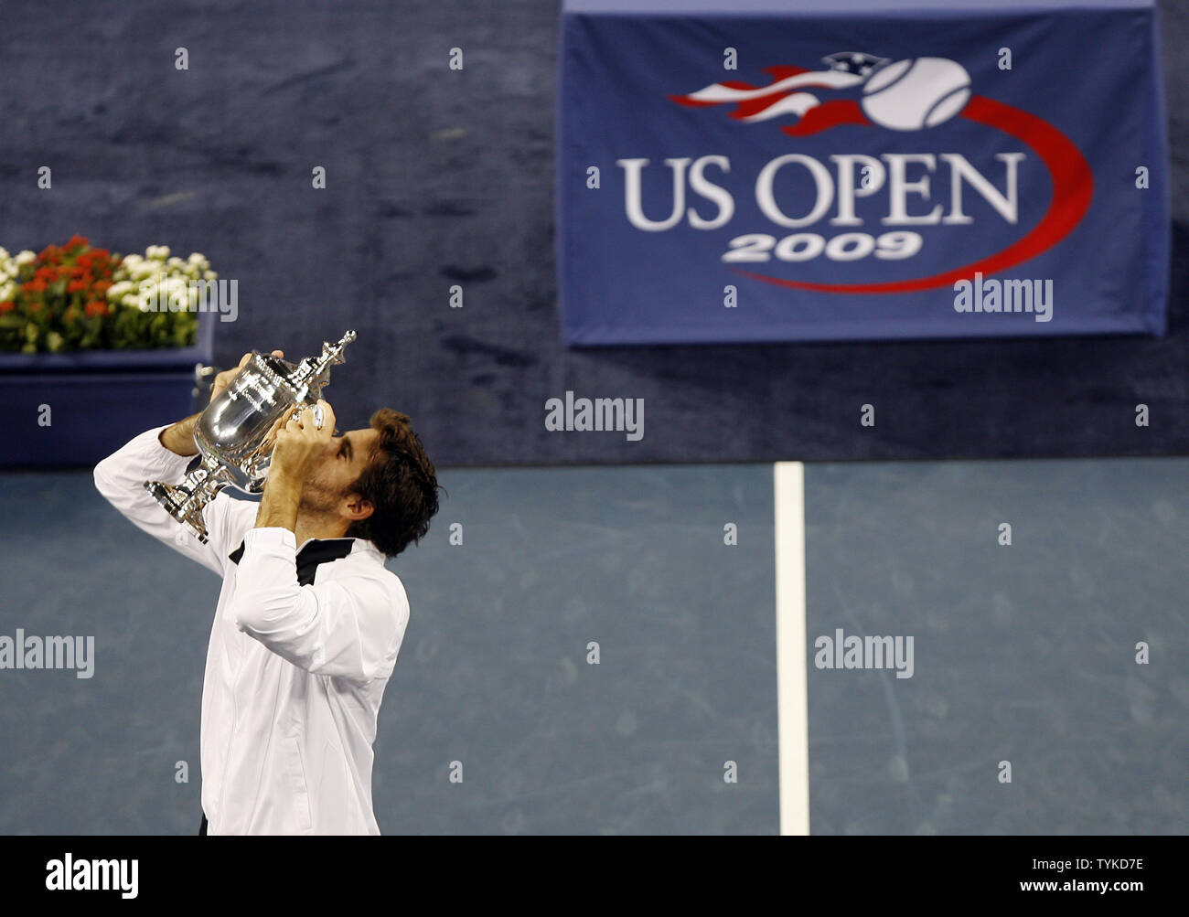Juan Martin Del Potro of Argentina kisses the champions trophy after defeating Roger Federer of Switzerland in 5 sets in the mens final in Arthur Ashe Stadium at the US Open Tennis Championships at the Billie Jean King National Tennis Center in New York on September 14, 2009.  defeated Federer 3-6, 7-6 (5), 4-6, 7-6 (4), 6-2.   UPI/John Angelillo Stock Photo