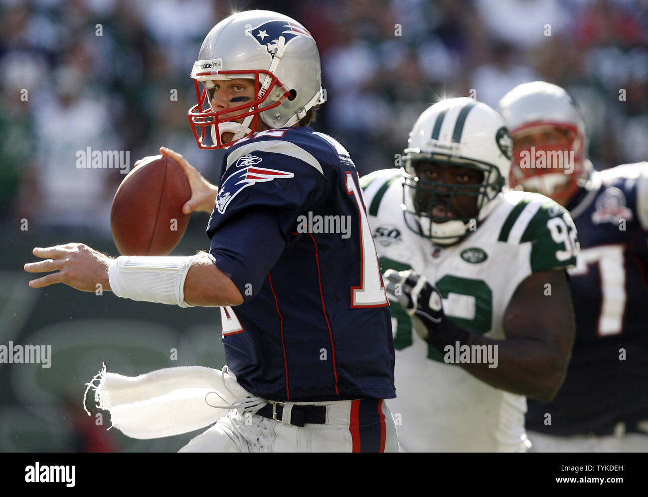 New England Patriots quarterback Tom Brady is pressured by New