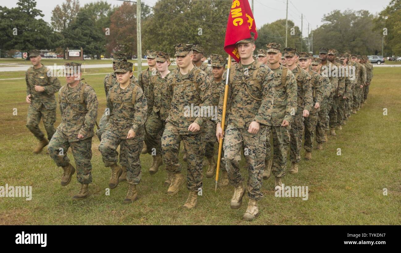 U.S. Marines with Headquarters and Support Battalion (H&S Bn), Marine Corps Installations East,  Marine Corps Base Camp Lejeune (MCIEAST, MCB CAMLEJ) march in place, during a battalion  formation, Camp Lejeune, Nov. 14, 2016. H&S Bn, MCIEAST, MCB CAMLEJ, conducted a 7.5  mile motivational and educational hike in recognition of the 75th anniversary of Camp Lejeune. Stock Photo