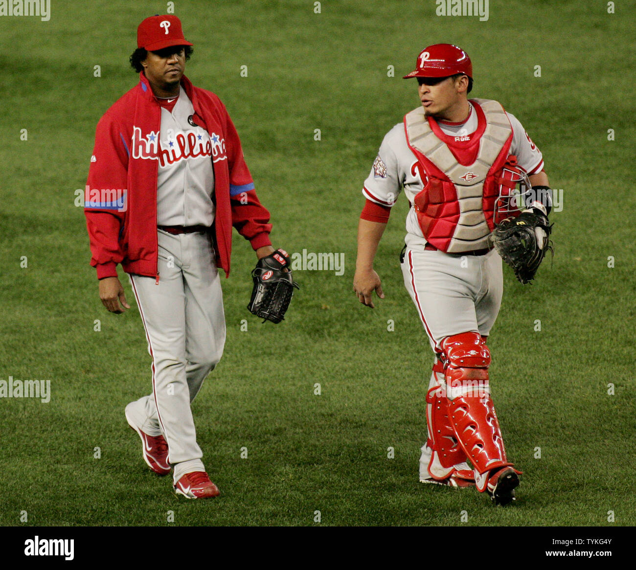 Pitcher Pedro Martinez (L) and catcher Carlos Ruiz walk towards the  Philadelphia Phillies' dugout before their game against the New York  Yankees during game two of the World Series at Yankee Stadium