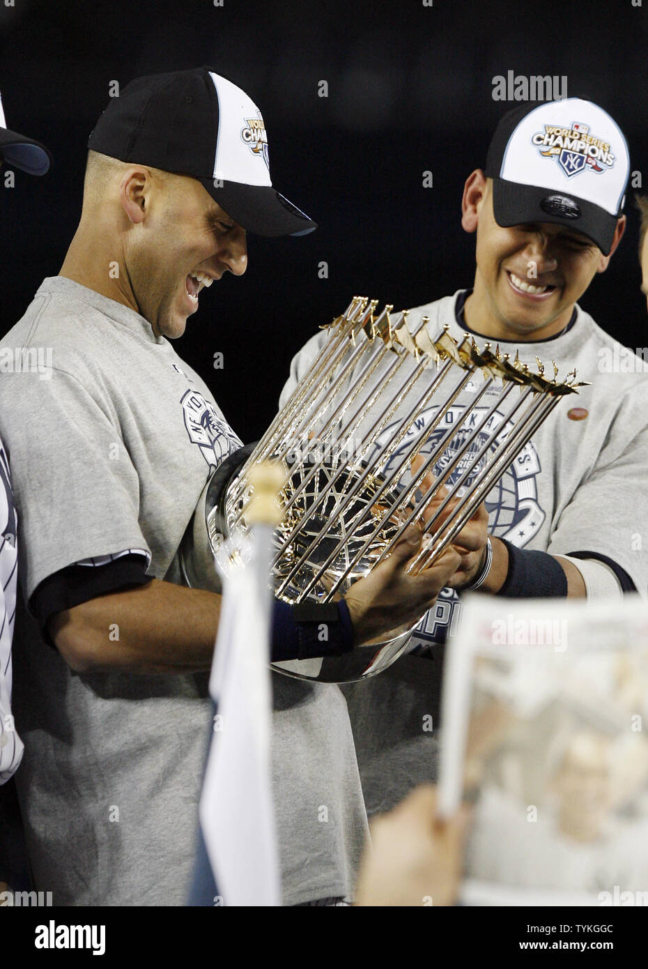New York Yankees Alex Rodriguez and Derek Jeter react holding the MLB World  Series Trophy after the game against the Philadelphia Phillies in game 6 of  the World Series at Yankee Stadium