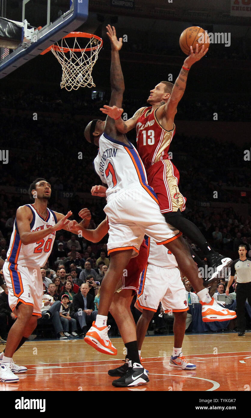 Cleveland Cavaliers Delonte West drives to the basket over New York Knicks  Al Harrington in the second quarter quarter at Madison Square Garden in New  York City on November 6, 2009. UPI/John