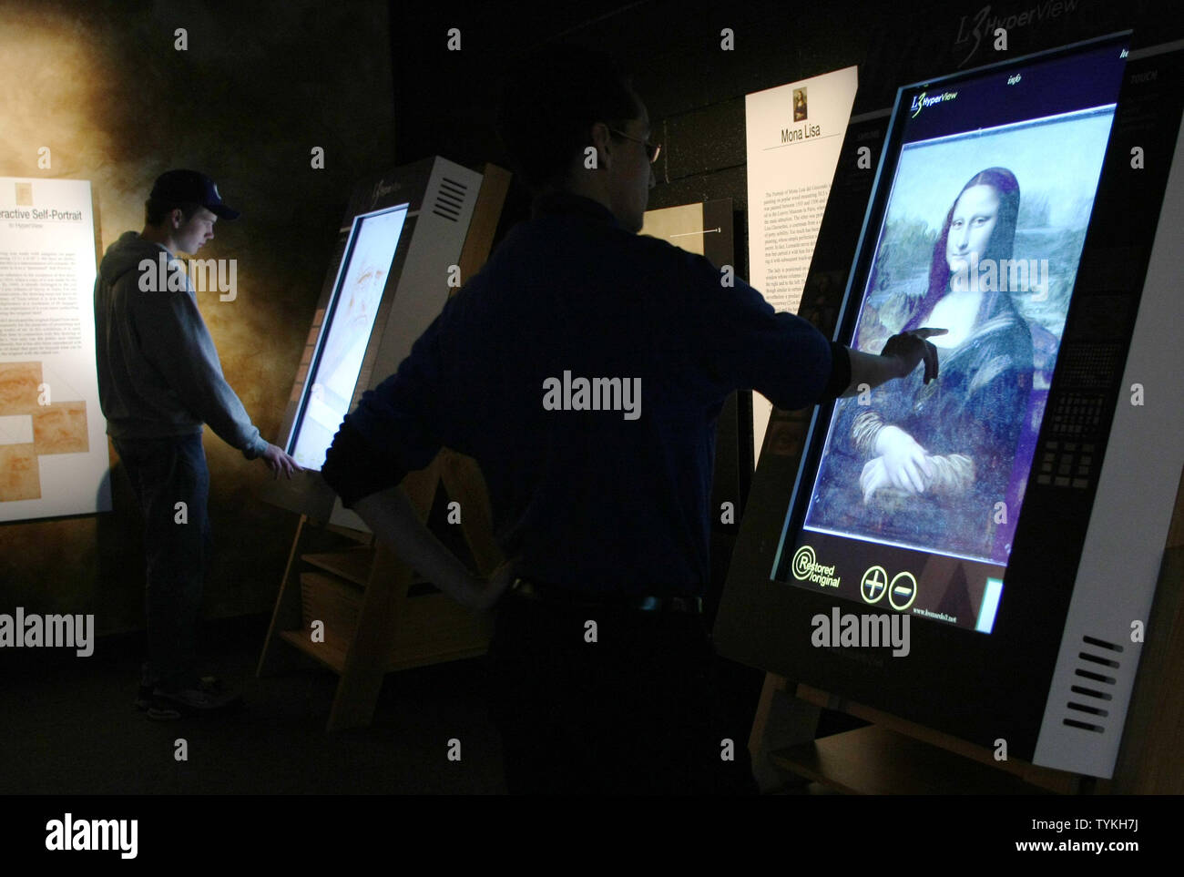 People use touch-screen computers to study details of the Mona Lisa ...