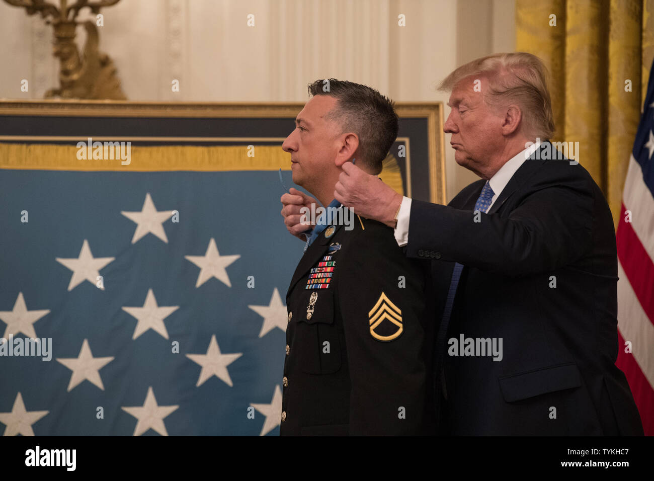 President Donald J. Trump presents the Medal of Honor to former U.S. Army Staff Sgt David G. Bellavia during a ceremony at the White House in Washington, D.C., June 25, 2019. Bellavia was awarded the Medal of Honor (Date), 2019, for actions while serving as a squad leader with the 1st Infantry Division in support of Operation Phantom Fury in Fallujah, Iraq when a squad from his platoon became trapped by intense enemy fire. (U.S. Army Photo by Sgt. Kevin Roy) Stock Photo