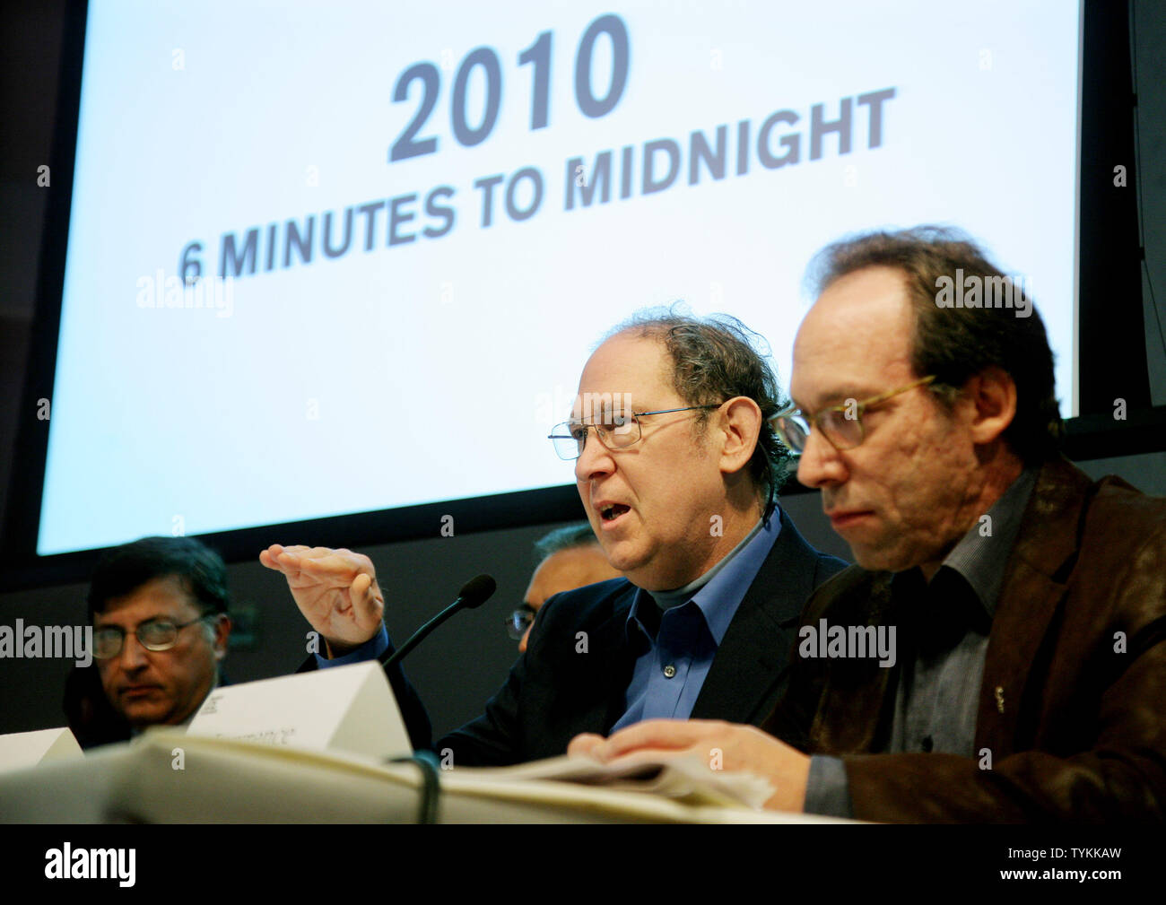 Stephen Schneider (C), a member of the Bulletin of the Atomic Scientists,  speaks as colleges Pervez Hoodbhoy (L) and Lawrence Krauss listen after the minute hand of the Doomsday Clock was symbolically moved back from five minutes to six before midnight at the New York Academy of Science on January 14, 2010 in New York. Some scientists believe that the clock's time leading up to midnight represents the world's vulnerability to catastrophe from nuclear war, climate change, and certain aspects of biotechnology.     UPI /Monika Graff Stock Photo