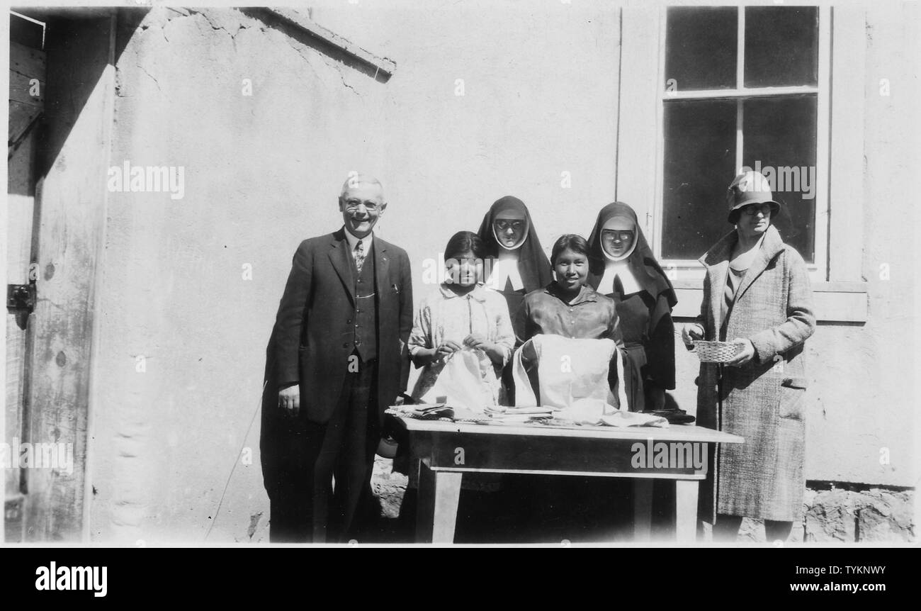 Students and teachers at Pueblo day school.; Scope and content:  This is a photograph of the McCarty's, Acomita, or Santo Domingo day schools, administered by the United Pueblos Agency in New Mexico. The Agency was formed in 1935 at Albuquerque, by consolidating the Santa Fe and Albuquerque Indian Schools, the Zuni Indian Agency, the Albuquerque Sanatorium, the Northern and Southern Pueblos Agencies, and the Navajo communities at Canoncito and Alamo. The day schools at which this photograph was taken was formerly under the jurisdiction of the Southern Pueblos Agency. Stock Photo