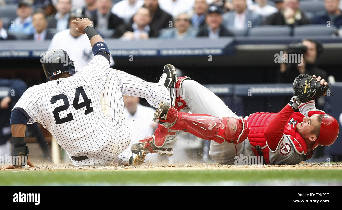 New York Yankees Robinson Cano 24 Is Called Out Sliding Into Los Angeles Angels Of Anaheim