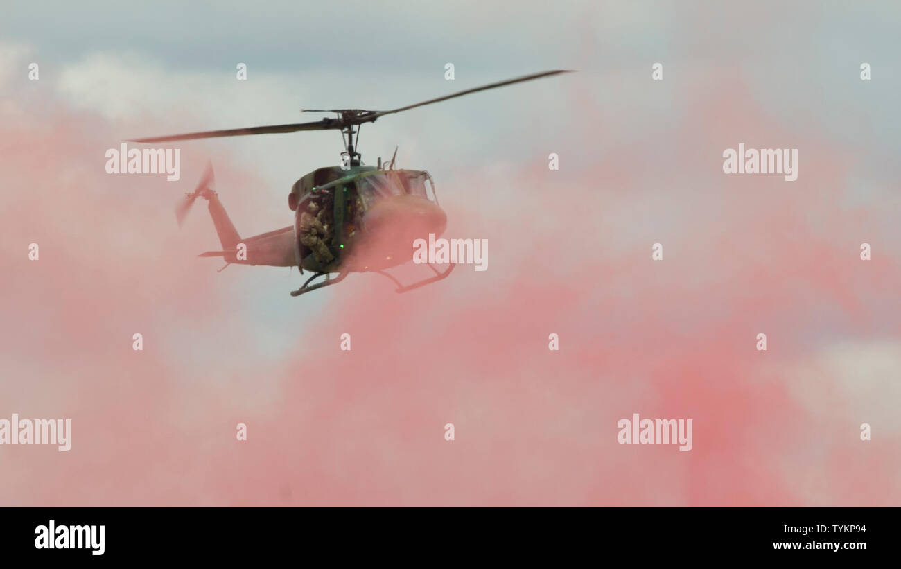 A UH1 Iroquois helicopter from the 36th Rescue Squadron hovers over a