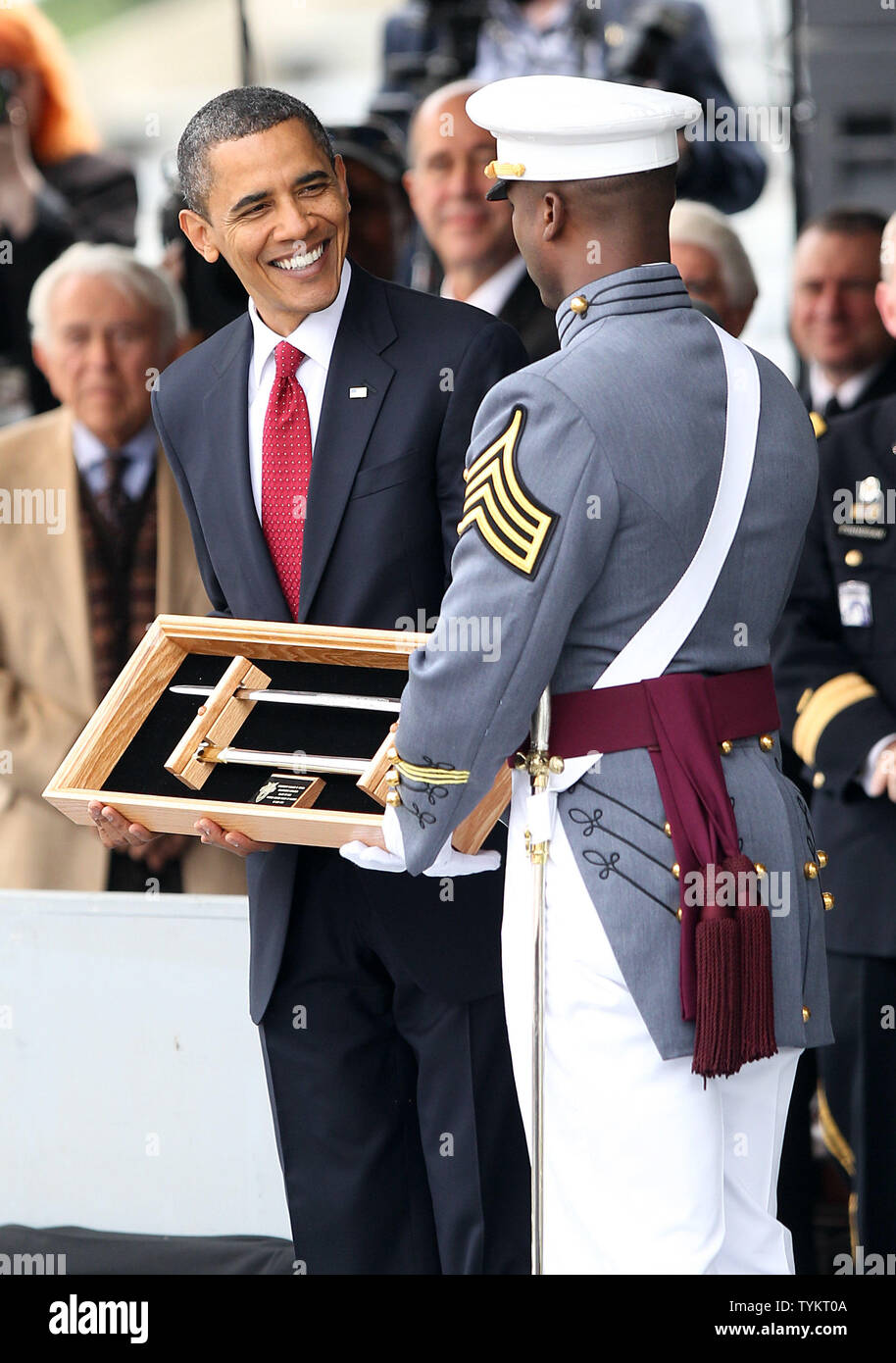 United States President Barack Obama receives a gift on stage at a ...