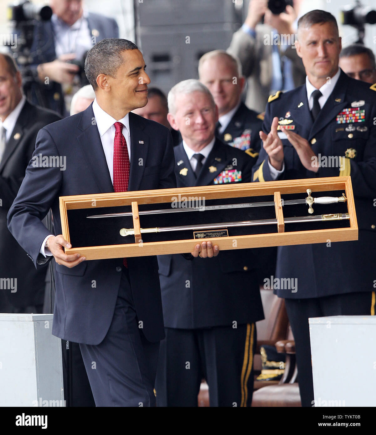 United States President Barack Obama receives a gift on stage at a ...