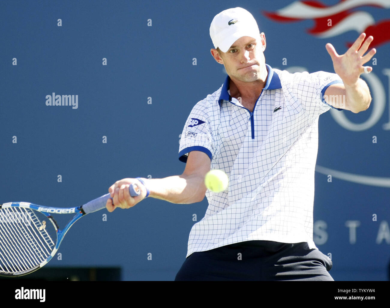Andy Roddick of the USA returns the ball to Stephane Robert of France  during first-round action at the U.S. Open held at the National Tennis  Center on August 30, 2010 in New