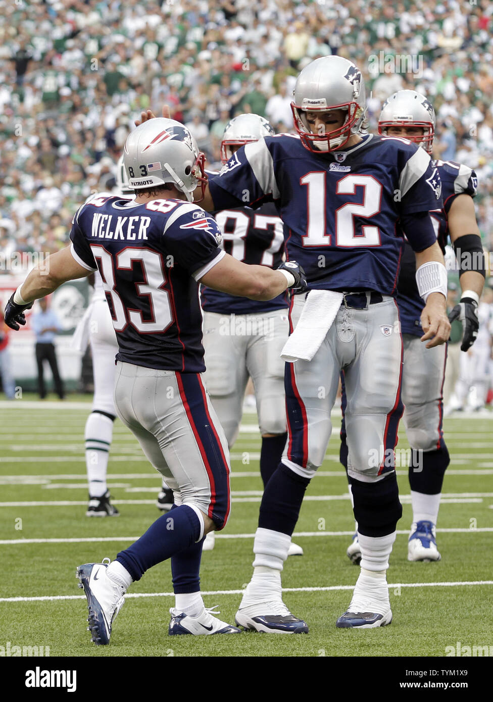 New England Patriots Tom Brady and Wes Welker react after Welker scores on  a 6 yard touchdown catch against the New York Jets in week 2 of the NFL  season at New