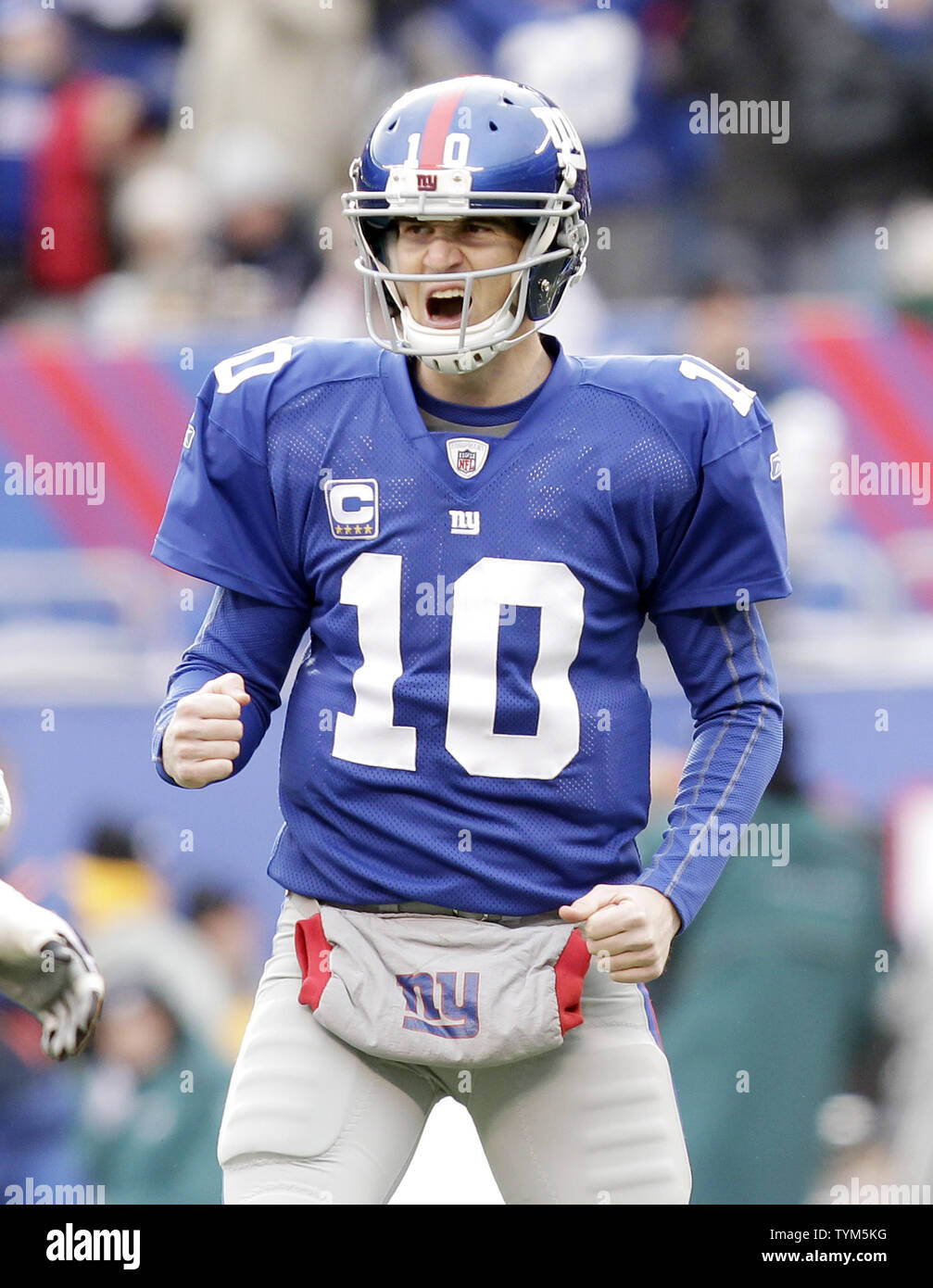 New York Giants Eli Manning reacts after throwing a 33 yard touchdown in  the second quarter against the Philadelphia Eagles at New Meadowlands  Stadium in week 15 of the NFL in East