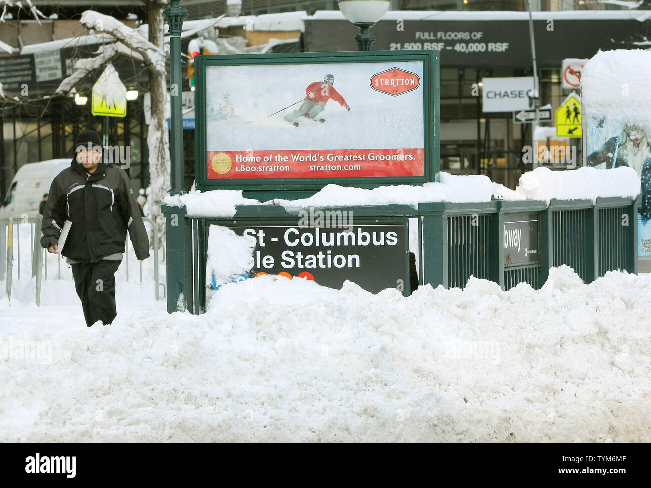 Snowbanks surround a subway entrance in Midtown after a major storm dumped around 19 inches of snow on January 27, 2011 in New York City. The storm caused suspension of may city bus lines and closed all public schools as this month became the snowiest January in New York City history.     UPI /Monika Graff Stock Photo
