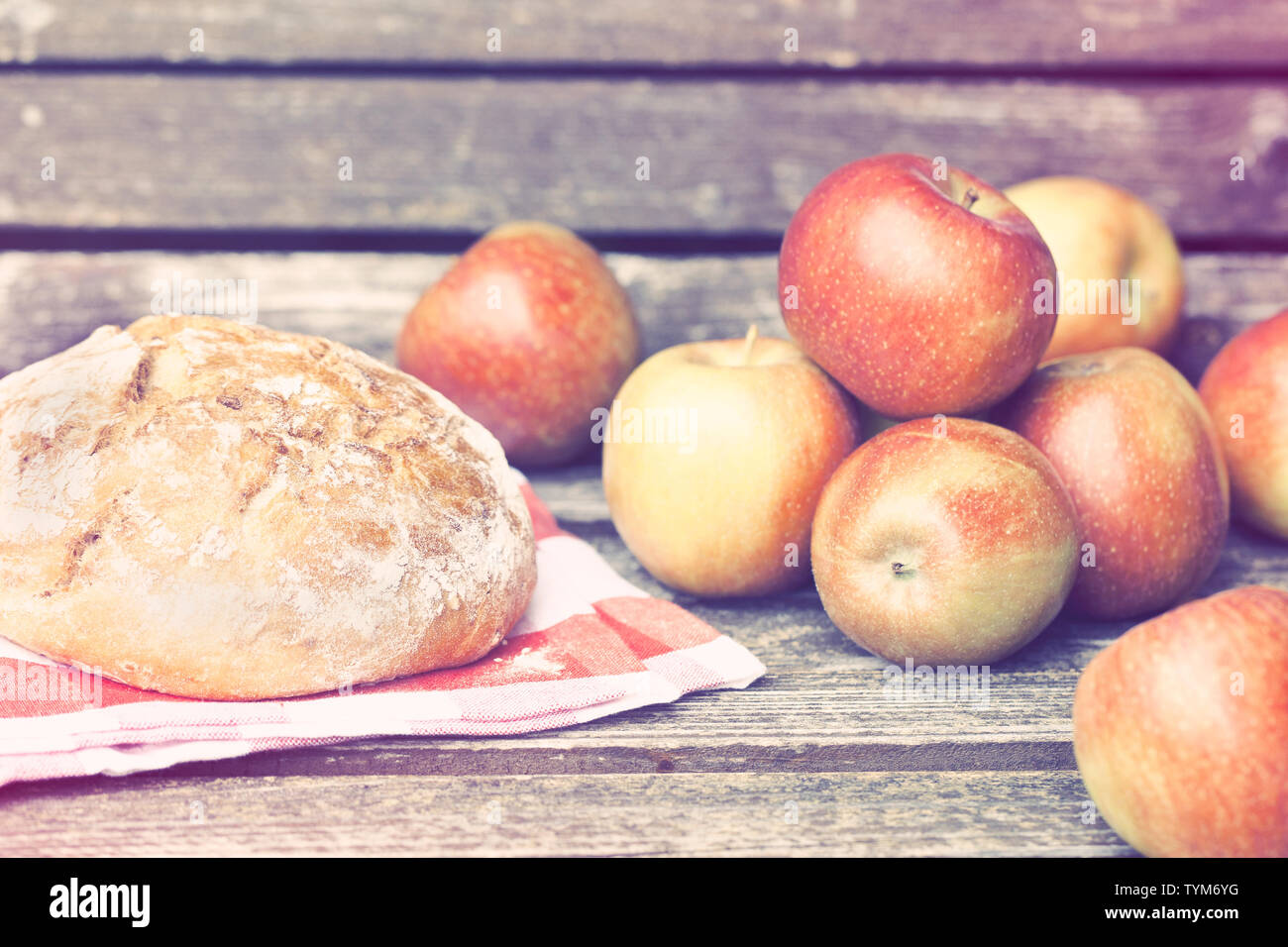 Bread and Apples on a bench Stock Photo