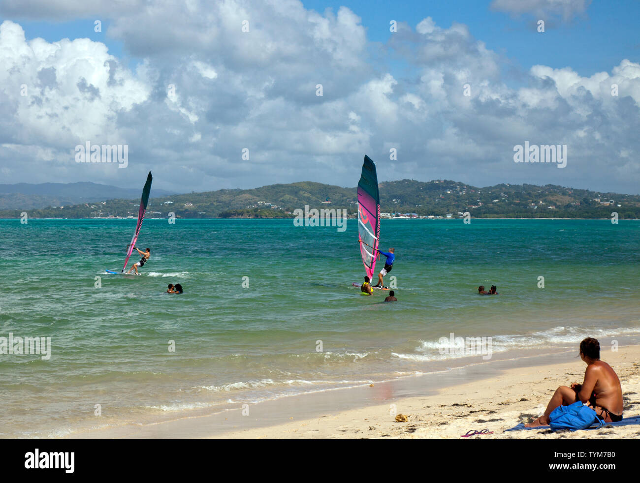 Windsurfing at Pigeon Point, Tobago.  Pigeon Point is also known as Pigeon Point Heritage Park (PPHP) and is often considered Tobago’s most beautiful Stock Photo