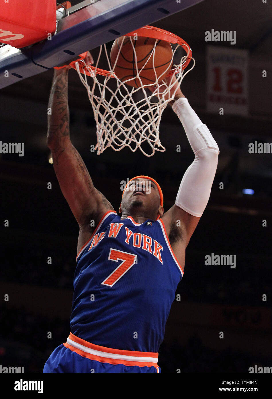 New York Knicks Carmelo Anthony dunks the ball in the second half against the Milwaukee Bucks in Carmelo Anthony s first game ever as a Knick at Madison Square Garden in New York