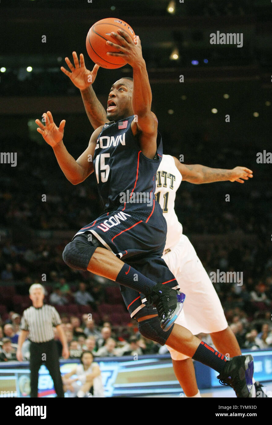 Kemba Walker of Connecticut goes to score against Pittsburgh in the