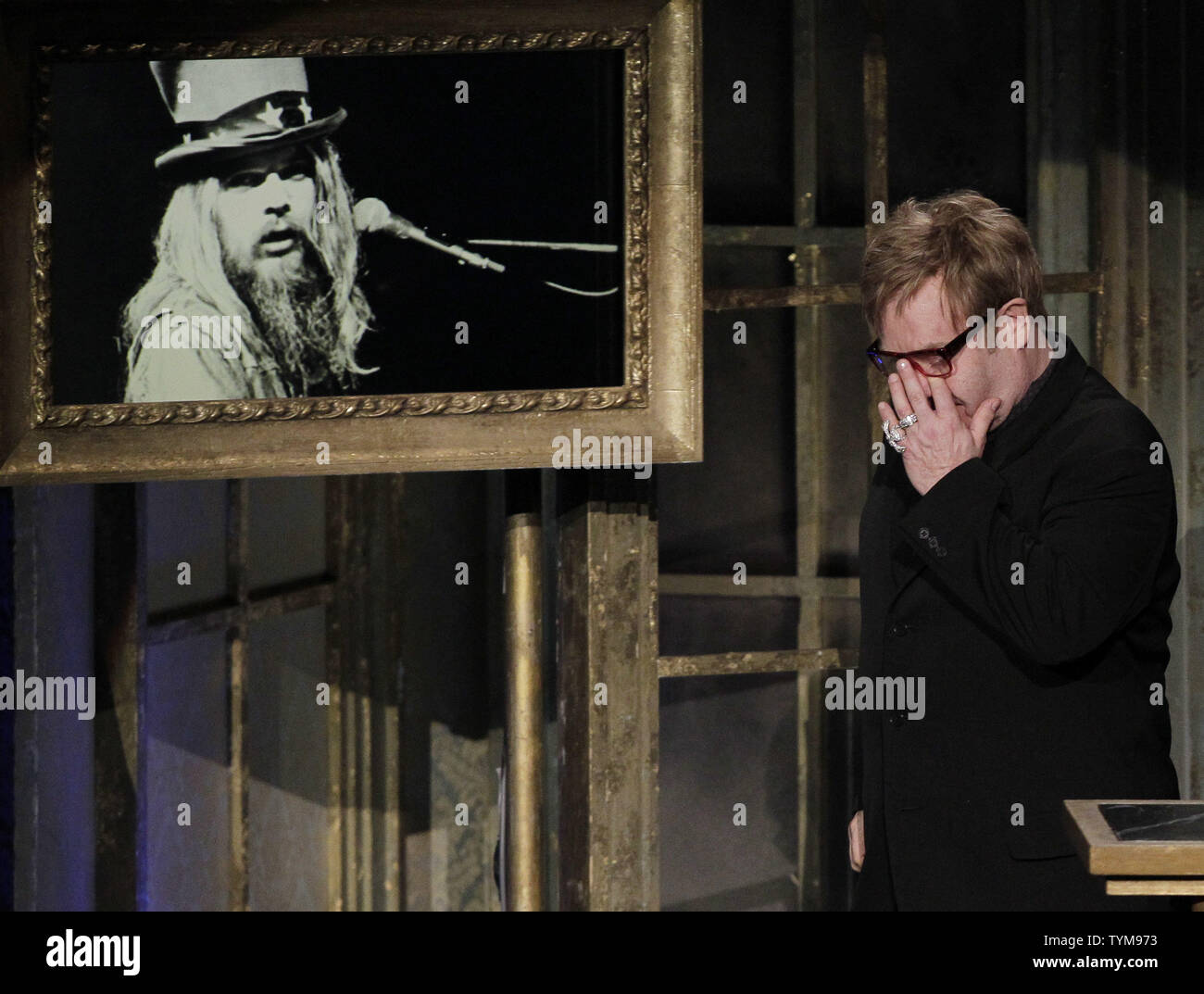 Elton John gets emotional as Leon Russell gets inducted into the Rock and Roll Hall of Fame at the Waldorf Astoria in New York City on March 14, 2011.  UPI/John Angelillo Stock Photo