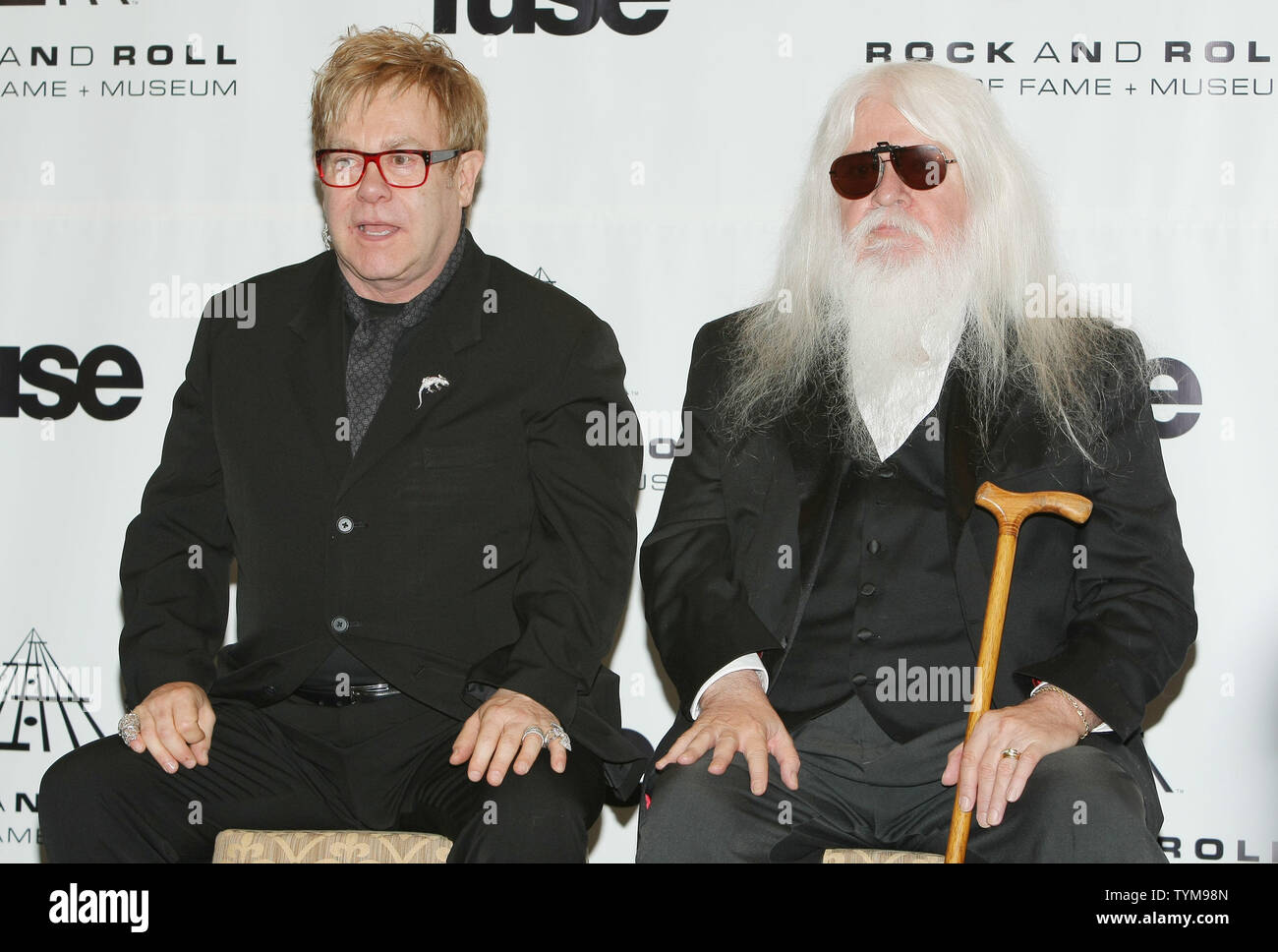 Elton John (L) answers reporters' questions as inductee Leon Russell listens at the Rock and Roll Hall of Fame induction ceremony held at the Waldorf-Astoria hotel in New York on March 14, 2011.      UPI Photo/Monika Graff... Stock Photo
