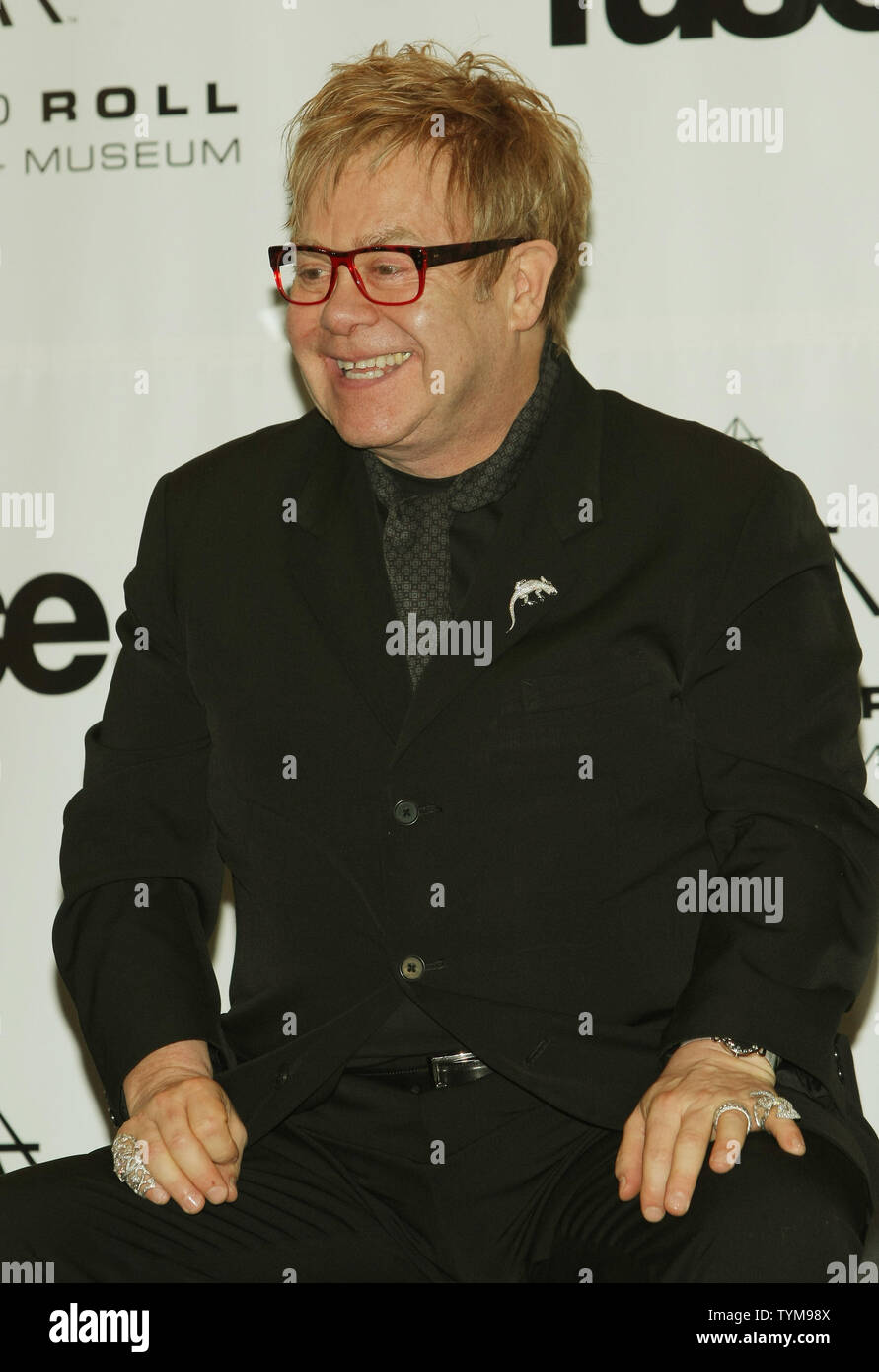 Elton John talks to reporters at the Rock and Roll Hall of Fame induction ceremony where he will introduce inductee Leon Russell at the Waldorf-Astoria hotel in New York on March 14, 2011.      UPI Photo/Monika Graff... Stock Photo