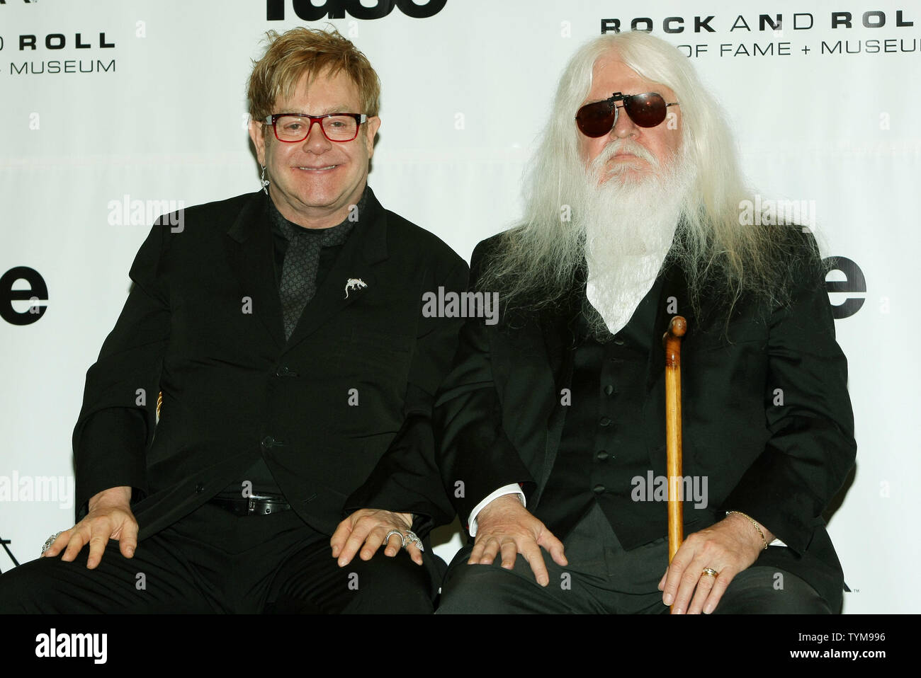 Elton John (L) and  inductee Leon Russell talk with reporters at the Rock and Roll Hall of Fame induction ceremony held at the Waldorf-Astoria hotel in New York on March 14, 2011.      UPI Photo/Monika Graff... Stock Photo