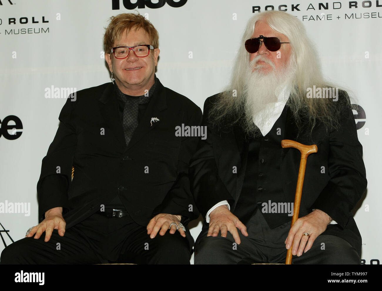 Elton John (L) answers reporters' questions as inductee Leon Russell at the Rock and Roll Hall of Fame induction ceremony held at the Waldorf-Astoria hotel in New York on March 14, 2011.      UPI Photo/Monika Graff... Stock Photo