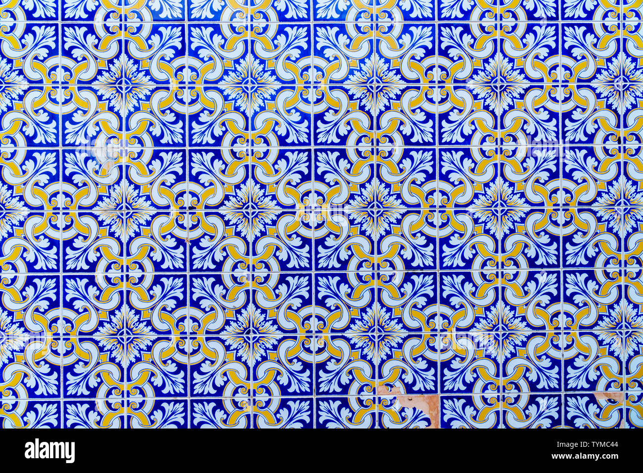 Repeated pattern of traditional Portuguese azulejo tiles - blue, yellow and white (close-up, frontal parallel view) Stock Photo