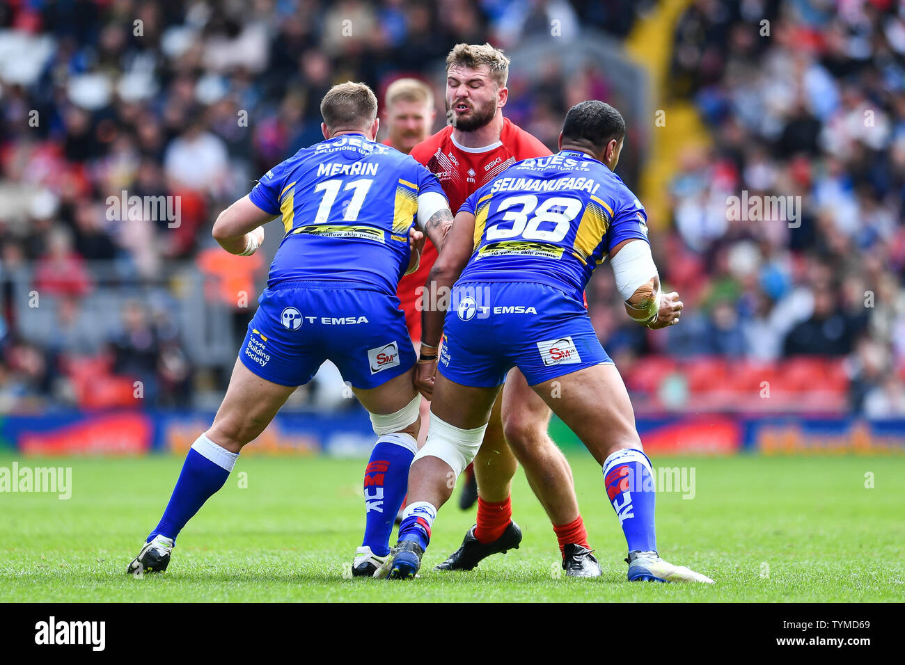 26th May 2019 , Anfield Stadium, Liverpool, England; Dacia Magic Weekend, Betfred Super League Round 16, Leeds Rhinos vs London Broncos ; Robert Butler (23) of London Broncos is tackled by Avagala Seumanufagai (38) and Trent Merrin (11) of Leeds Rhinos  Credit: Craig Thomas/News Images Stock Photo