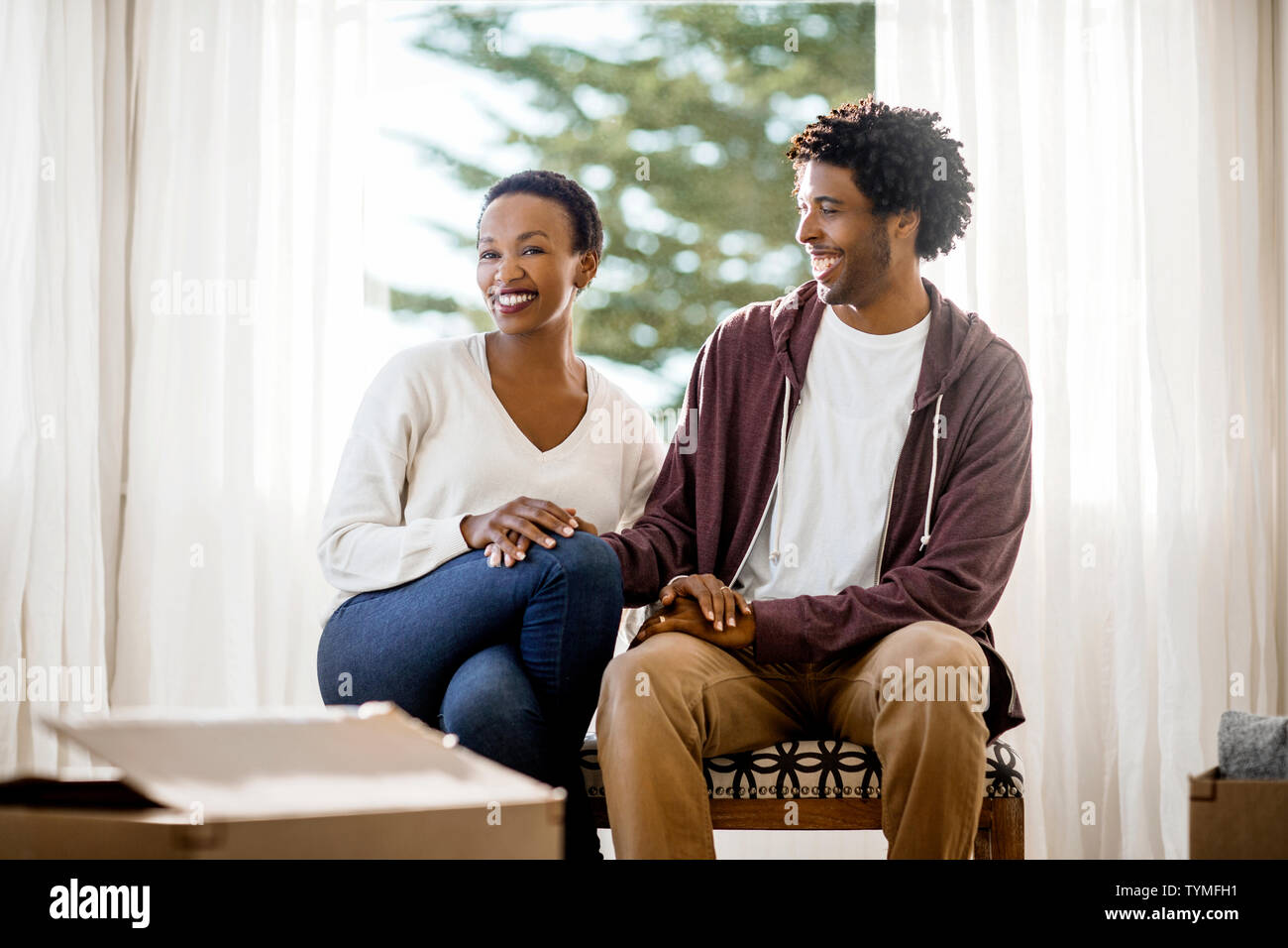 Happy couple in their new home Stock Photo - Alamy
