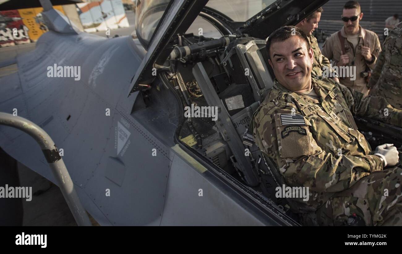 U.S. Army Master Sgt. (retired) Leroy Petry, Medal of Honor recipient, sits in the cockpit of an F-16 Fighting Falcon at Bagram Airfield, Afghanistan, Oct. 16, 2016. Petry was one of six wounded warriors to participate in Operation Proper Exit, a program that returns battle-wounded service members to theater. Stock Photo