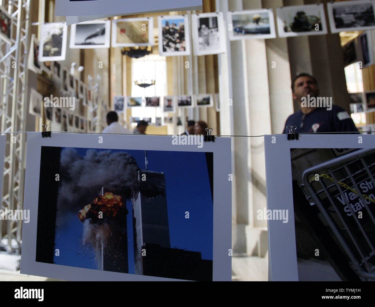 A Man Looks At Photographs That Were Taken Around The Time