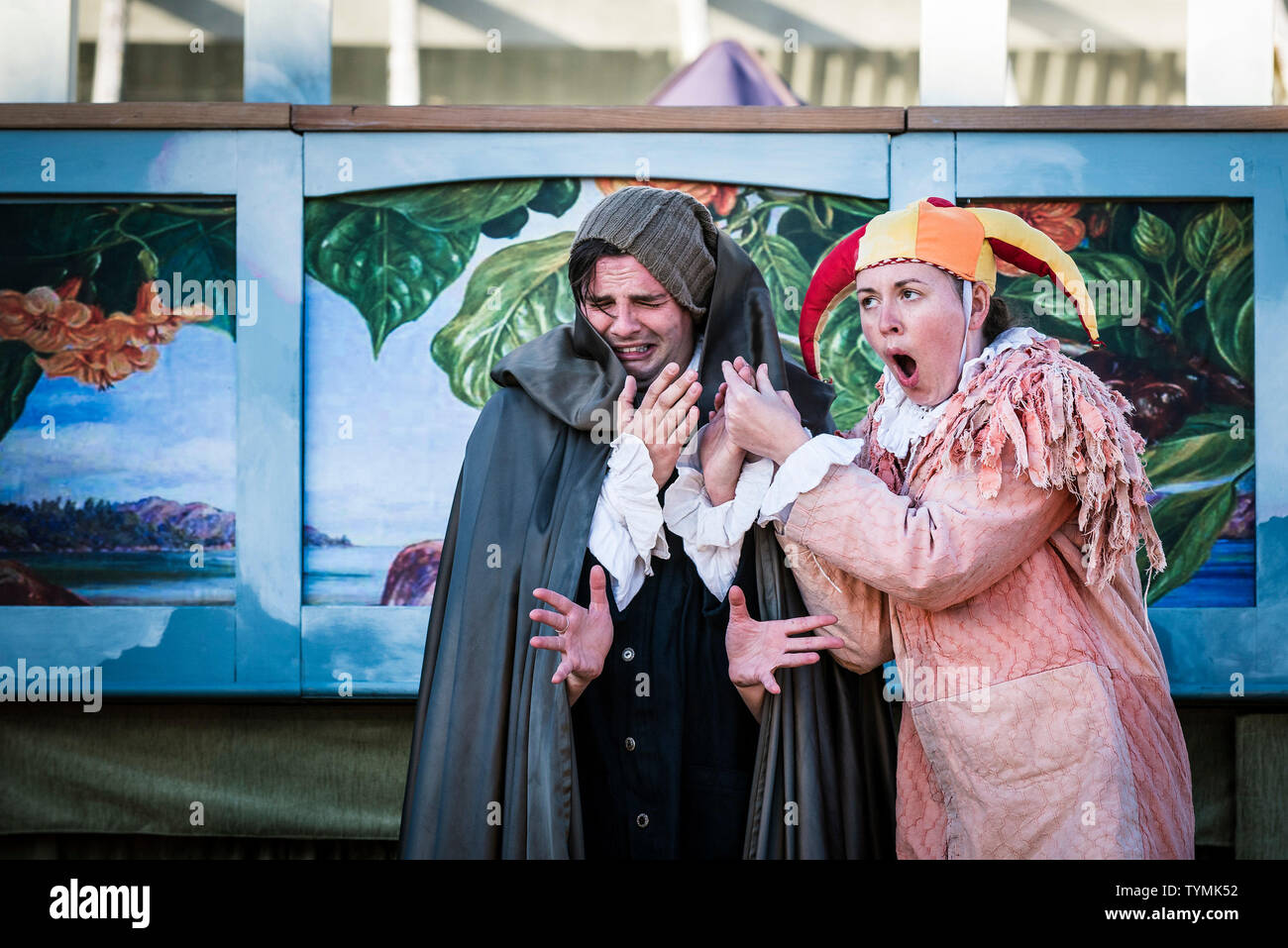 Actors Chris Wills; Katy Helps, performing the roles of Caliban and Trinculo in an outdoor theatre production of The Tempest by Illyria Theatre in Fal Stock Photo