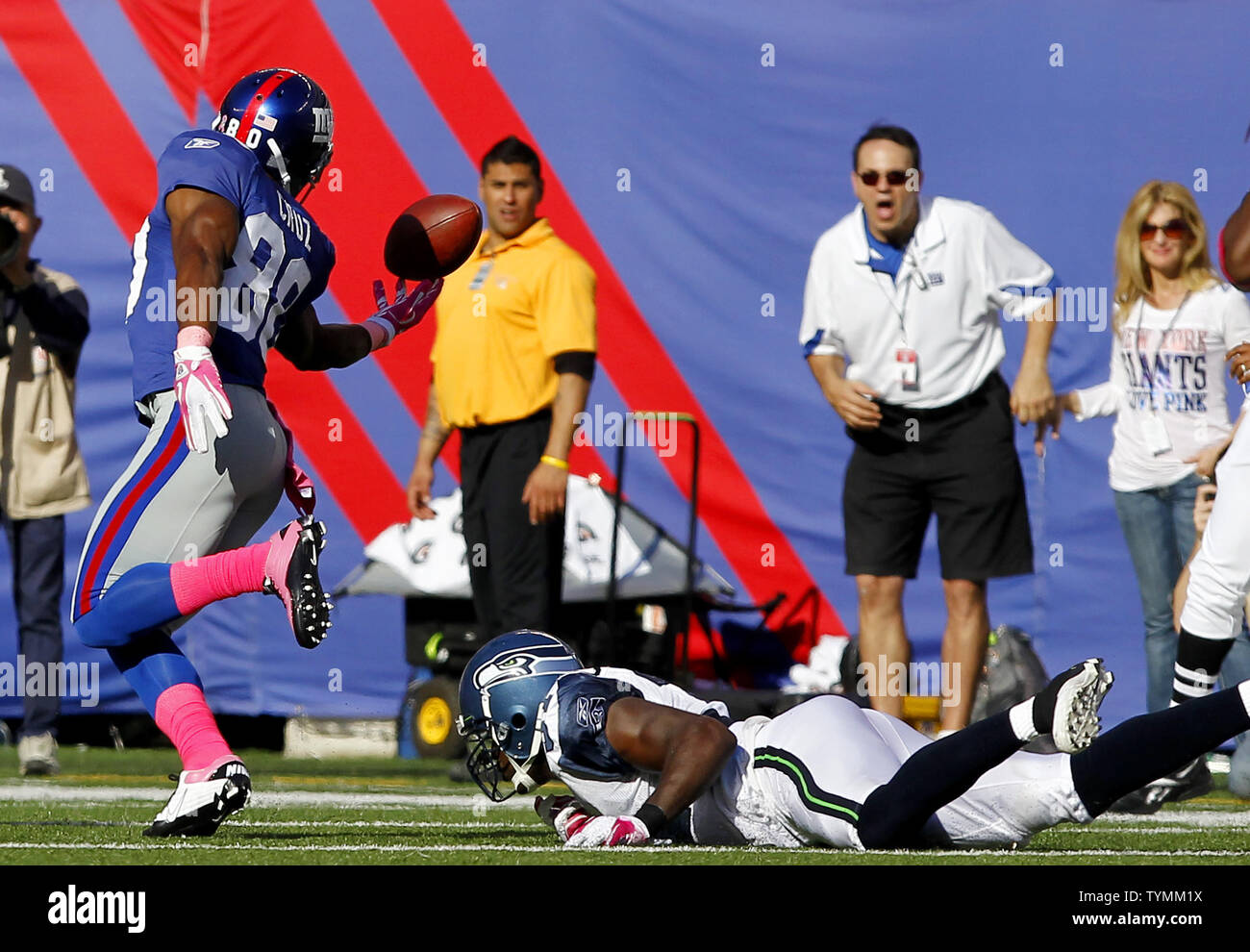 Seattle Seahawks Kam Chancellor falls to the ground as New York Giants  Victor Cruz makes a one handed catch for 41 yards in the fourth quarter in  week 5 of the NFL