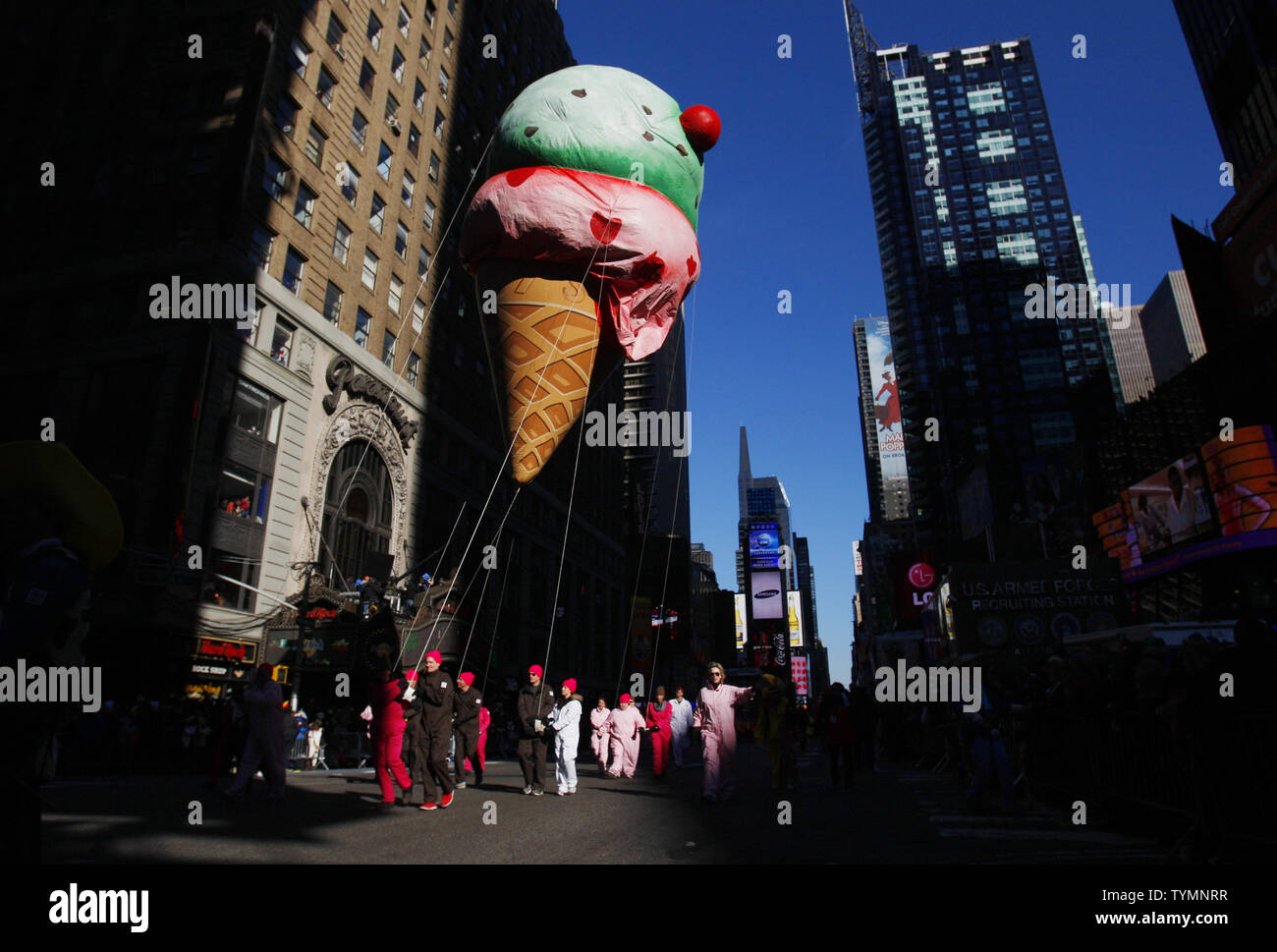 An Ice Cream Cone balloon floats down the parade route at the Macy's