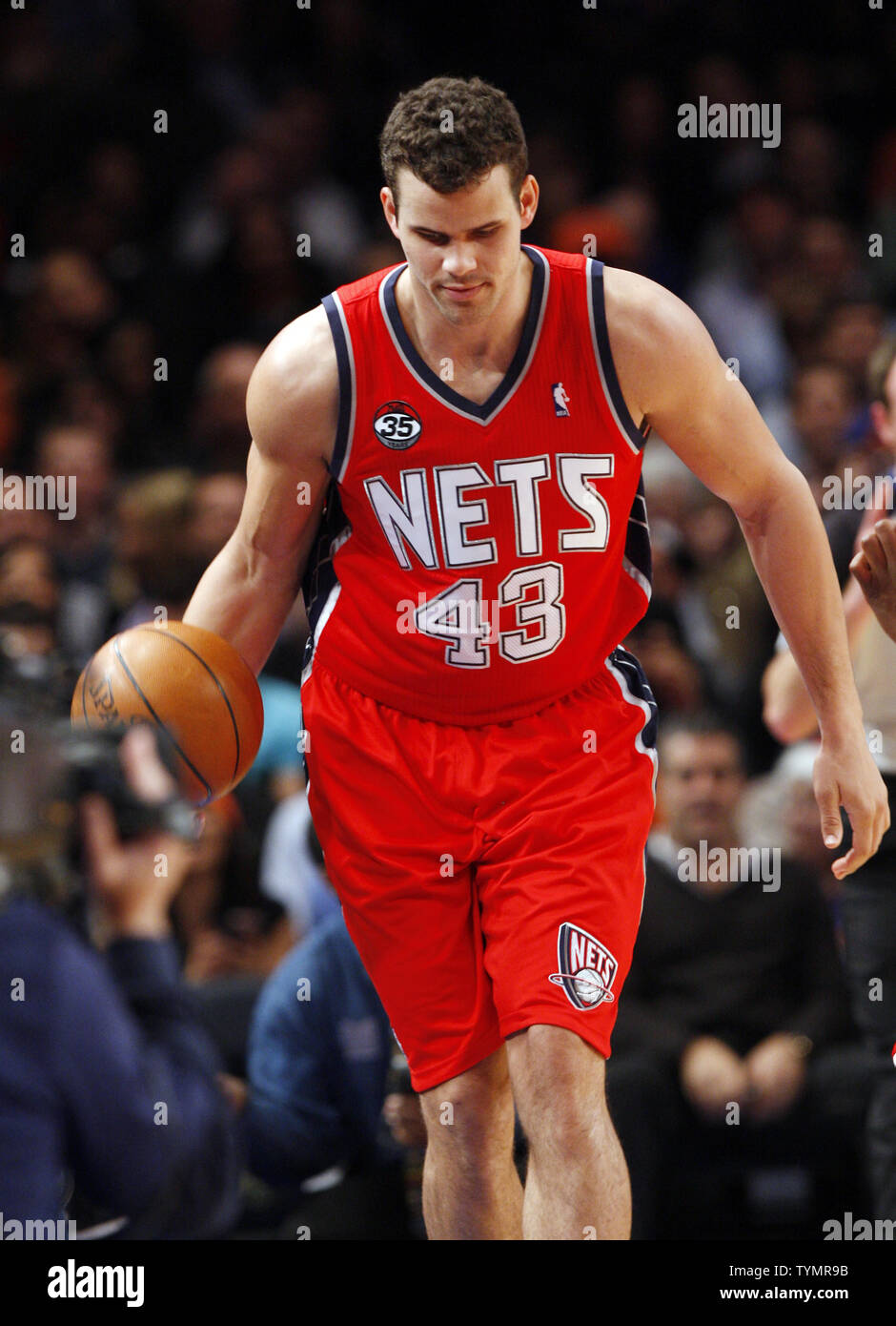New Jersey Nets Kris Humphries takes the ball up the court in the first  half against the New York Knicks in the 2011 NBA Pre-season at Madison  Square Garden in New York