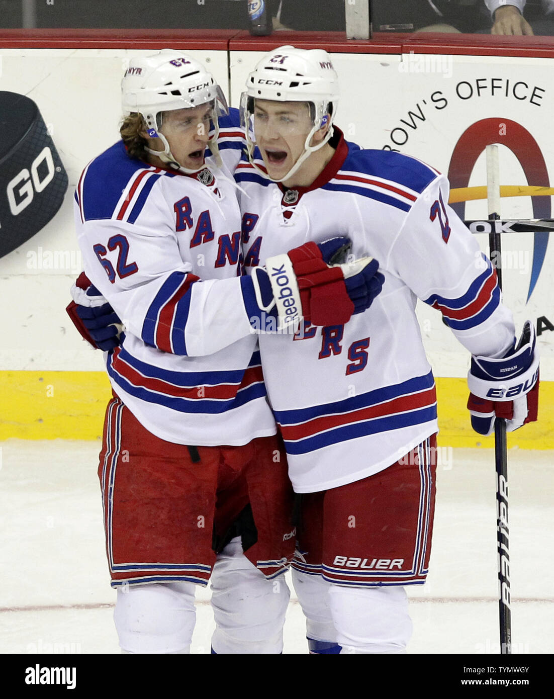 New York Rangers Derek Stepan reacts with Carl Hagelin after scoring a goal in the second period against the New Jersey Devils at the Prudential Center in Newark, New Jersey on March 6, 2012.   UPI/John Angelillo Stock Photo