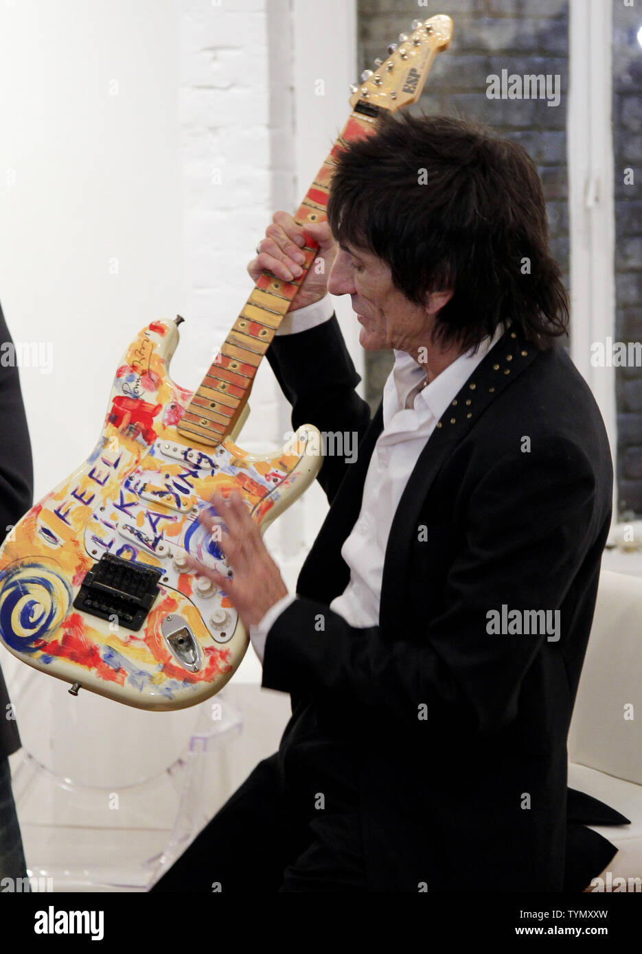 Rolling Stones guitarist Ron Ronnie Wood speaks at a press conference