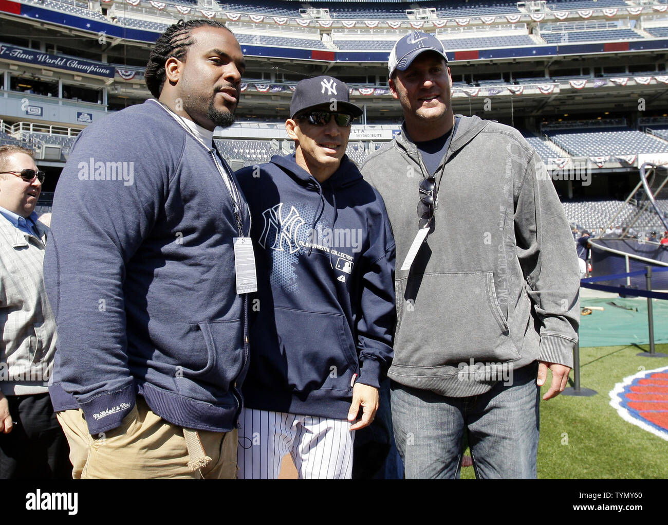 Pittsburgh Steelers Willie Colon and Ben Roethlisberger stand with Yankee  Manager Joe Girardi before the New York Yankees play the Los Angeles Angels  on Opening Day at Yankee Stadium in New York