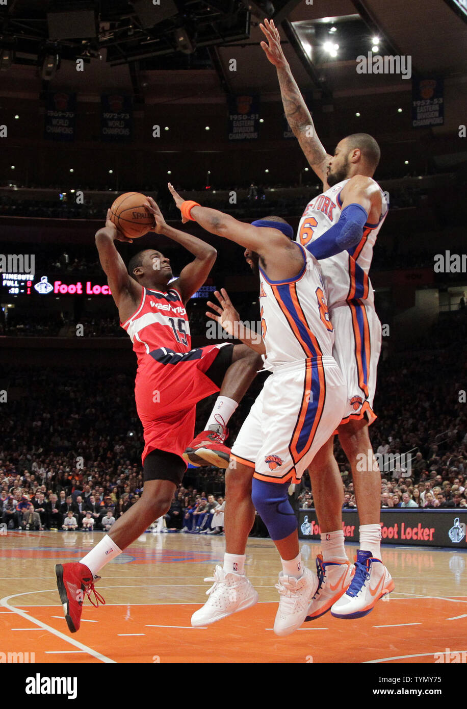 New York Knicks Tyson Chandler and Baron Davis try to block a shot from Washington Wizards Jordan Crawford in the first quarter at Madison Square Garden in New York City on April 13, 2012.  UPI/John Angelillo Stock Photo