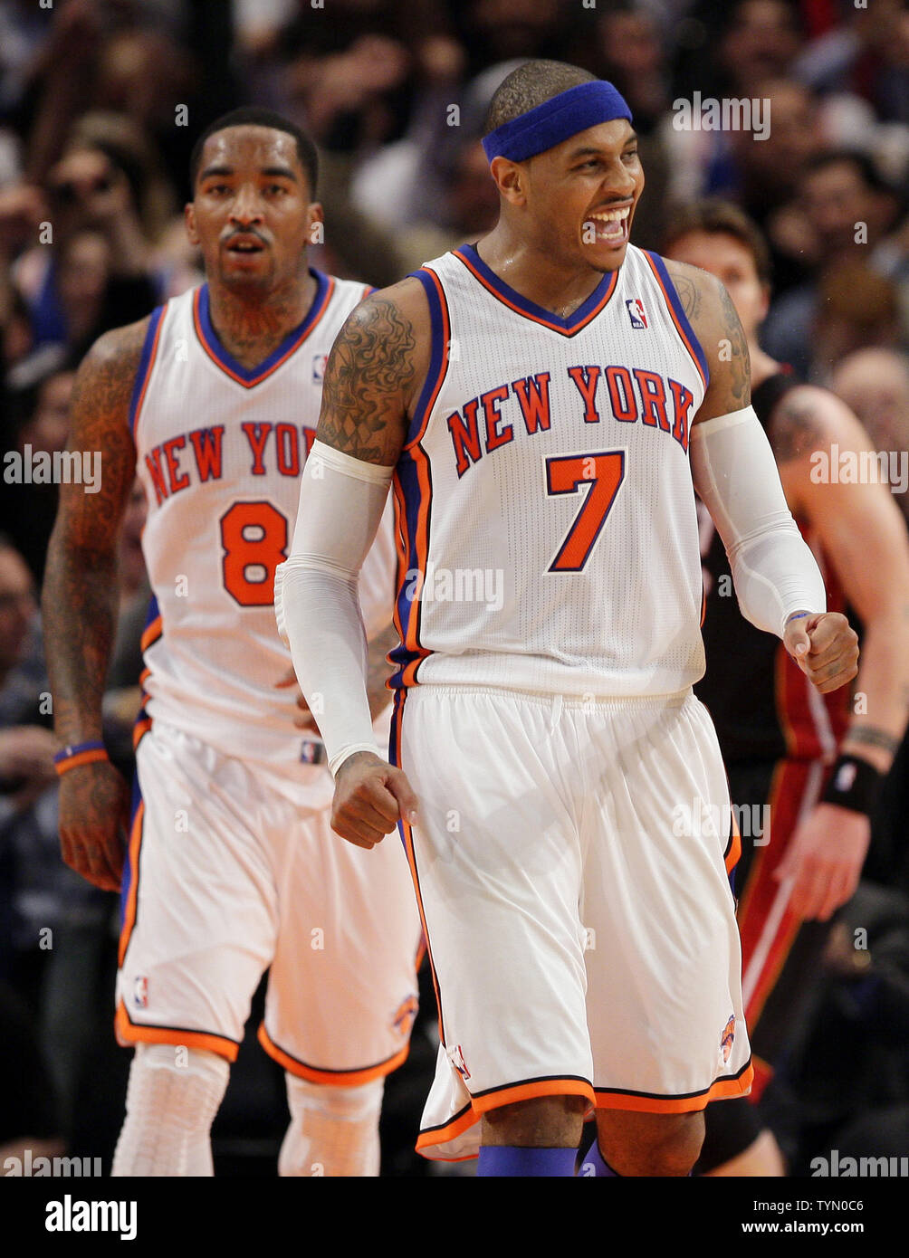 New York Knicks Carmelo Anthony and J.R. Smith smile at each other