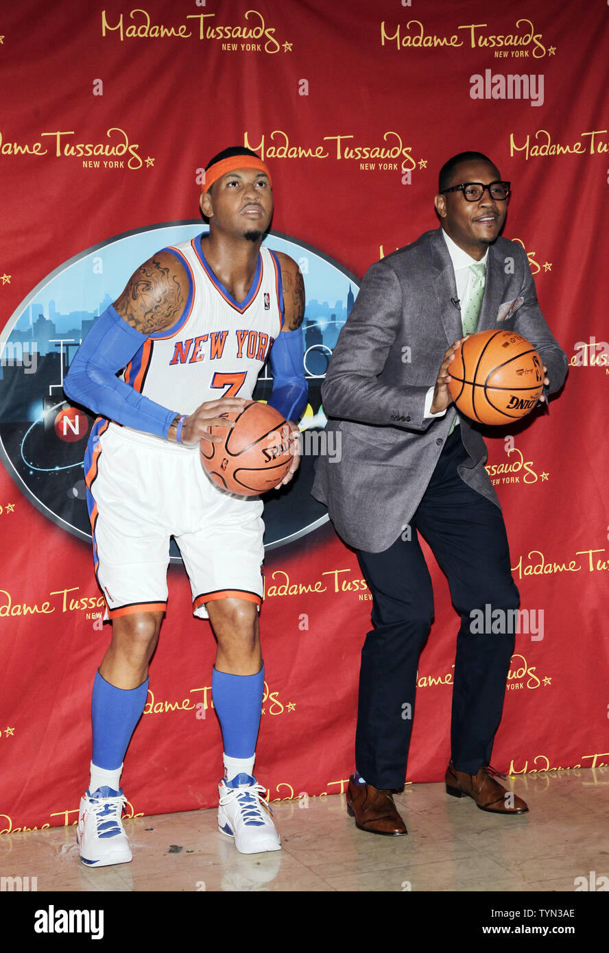 New York Knicks star Carmelo Anthony poses next to his Wax Figure when it is unveiled for the first time at Madame Tussauds in New York City on June 26, 2012.       UPI/John Angelillo Stock Photo