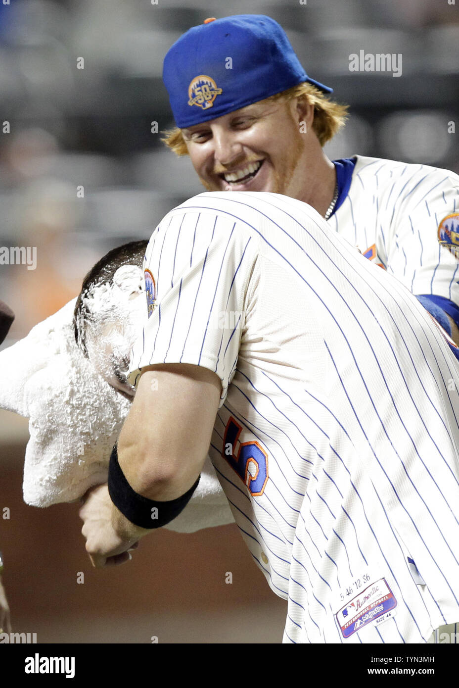 New York Mets David Wright is hit in the face with cream by Justin Turner  after Wright hits a walk off single in the ninth inning against  Philadelphia Phillies closer Jonathan Papelbon
